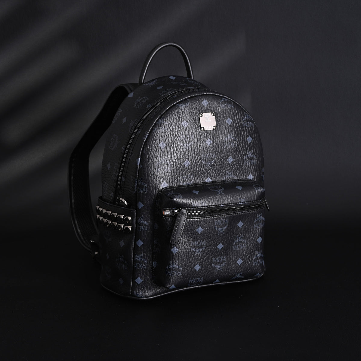 MCM Stark Visetos Medium Backpack ¨C Black Monogram with Studded Detailing