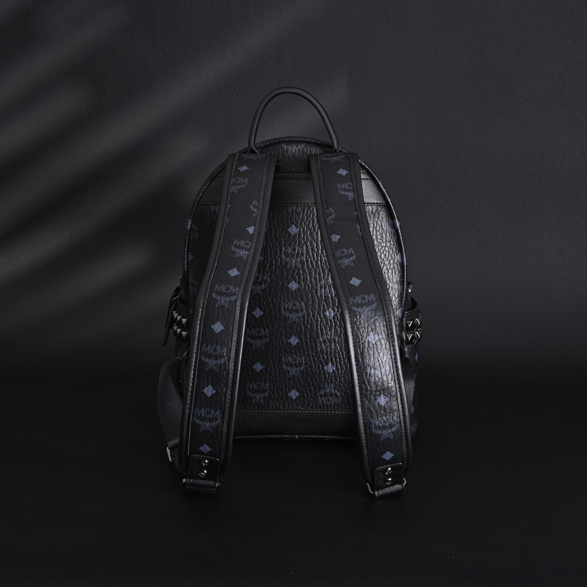 MCM Stark Visetos Medium Backpack ¨C Black Monogram with Studded Detailing