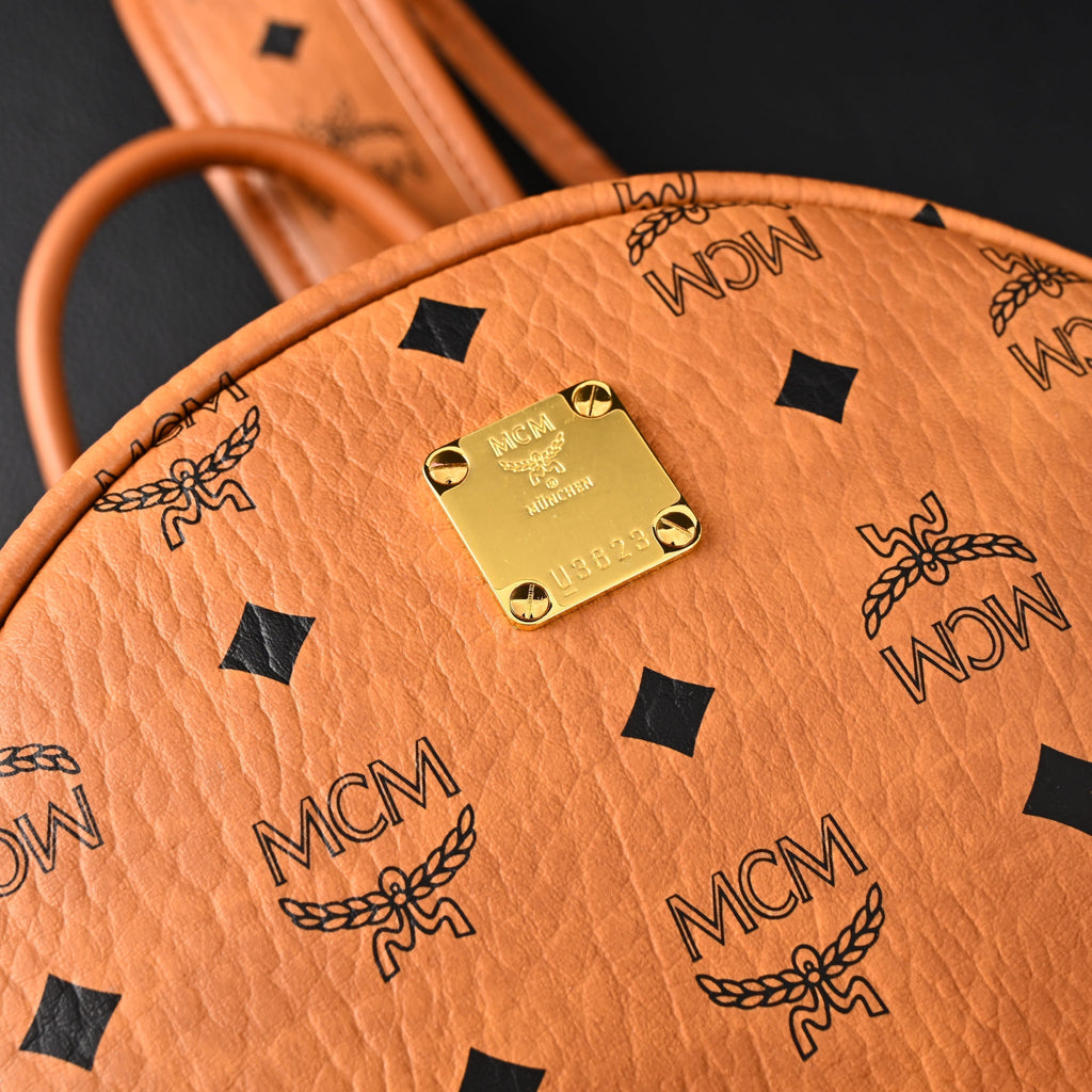 MCM Stark Visetos Medium Backpack ¨C Cognac Monogram with Gold-Tone Studs