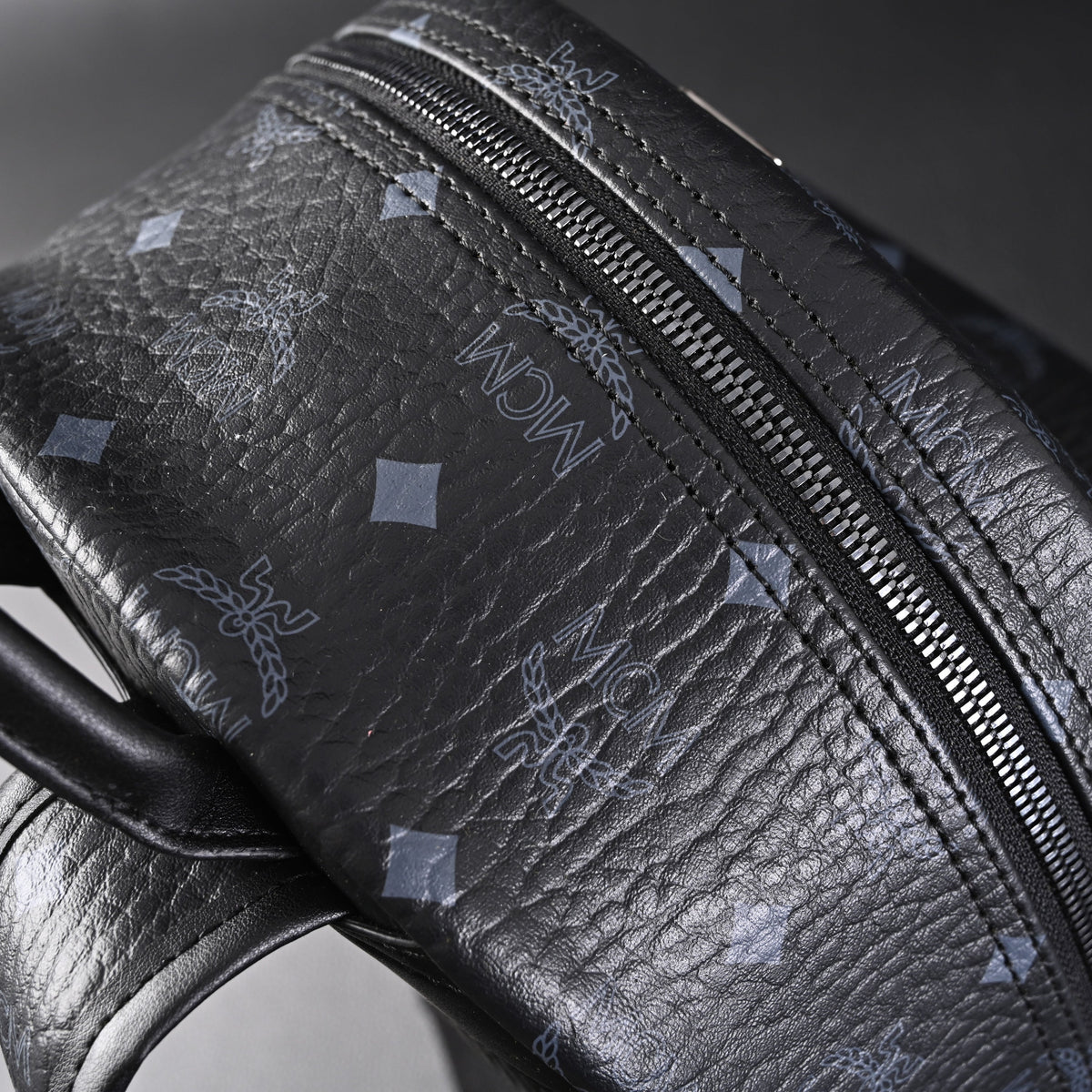 MCM Stark Visetos Medium Backpack ¨C Black Monogram with Studded Detailing