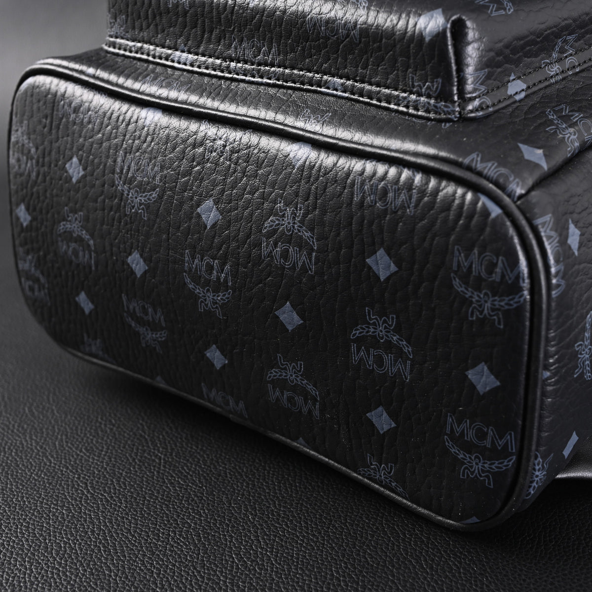 MCM Stark Visetos Medium Backpack ¨C Black Monogram with Studded Detailing
