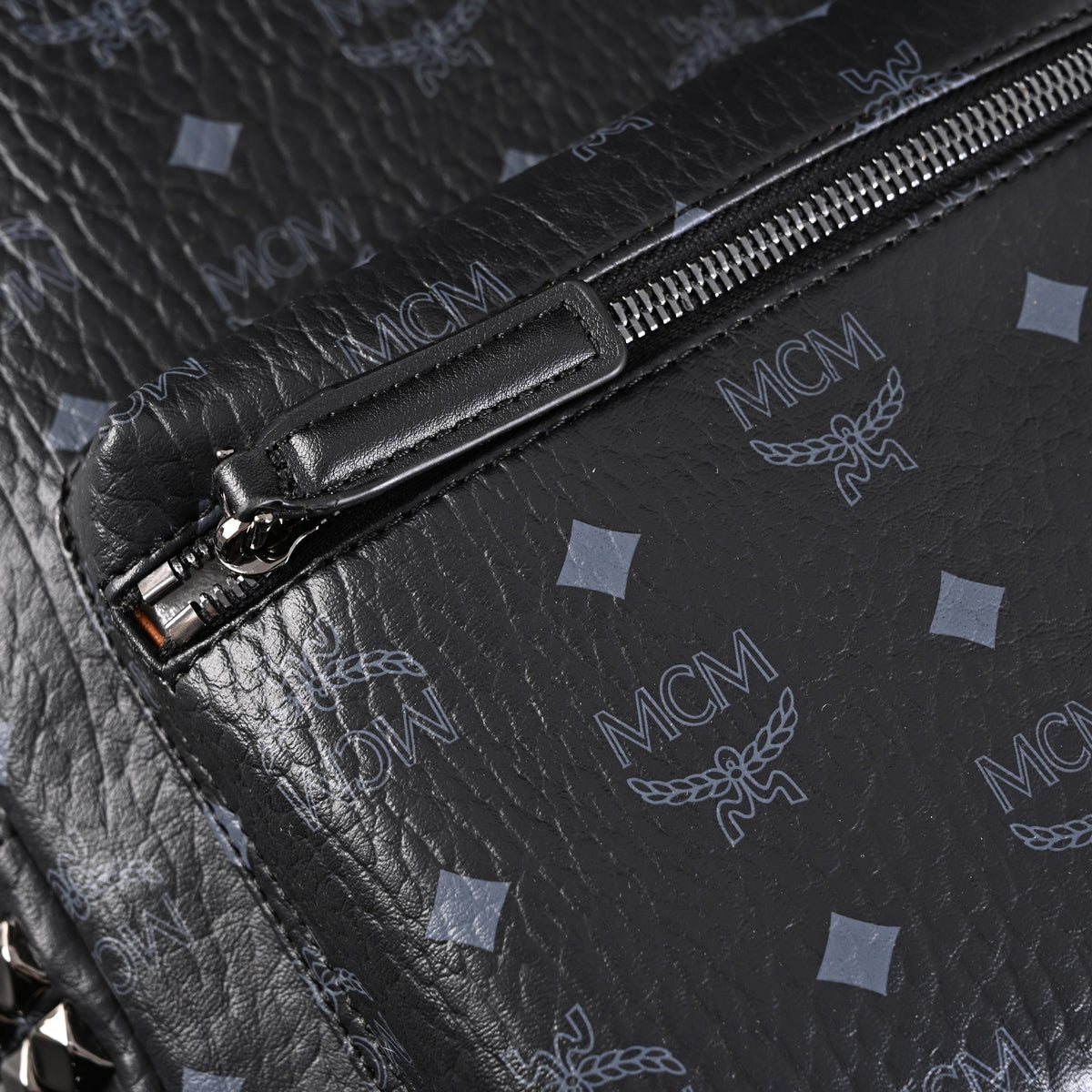 MCM Stark Visetos Medium Backpack ¨C Black Monogram with Studded Detailing
