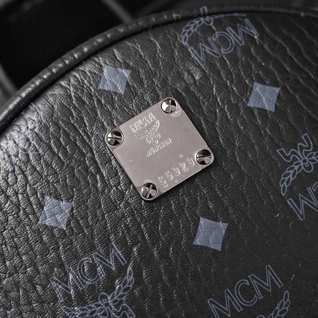 MCM Stark Visetos Medium Backpack ¨C Black Monogram with Studded Detailing