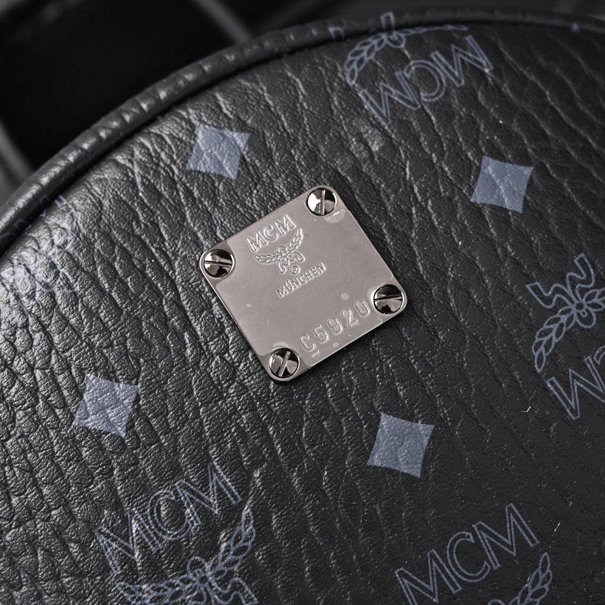 MCM Stark Visetos Medium Backpack ¨C Black Monogram with Studded Detailing
