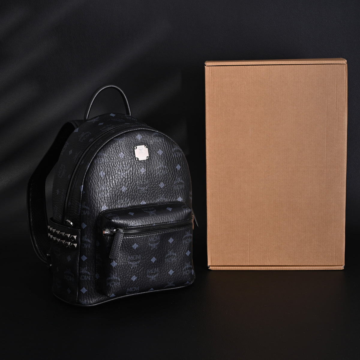 MCM Stark Visetos Medium Backpack ¨C Black Monogram with Studded Detailing