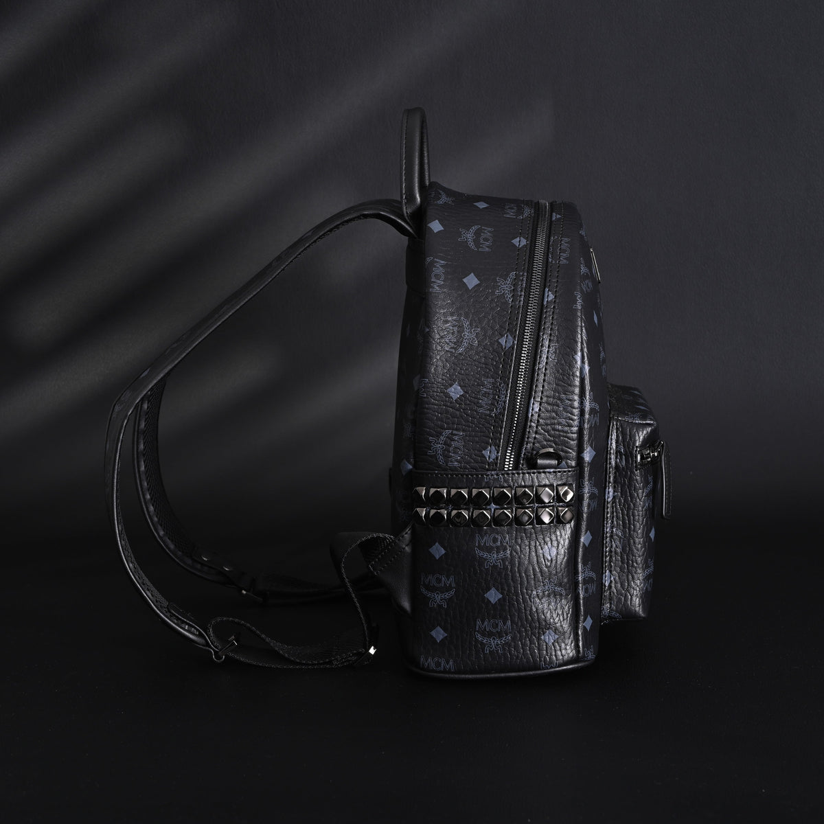 MCM Stark Visetos Medium Backpack ¨C Black Monogram with Studded Detailing