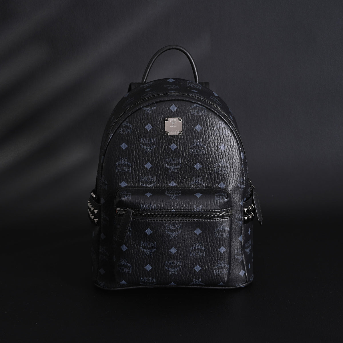 MCM Stark Visetos Medium Backpack ¨C Black Monogram with Studded Detailing