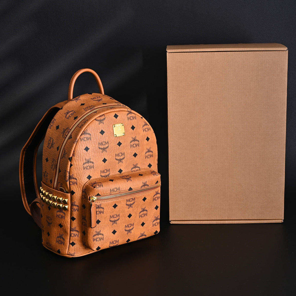 MCM Stark Visetos Medium Backpack ¨C Cognac Monogram with Gold-Tone Studs