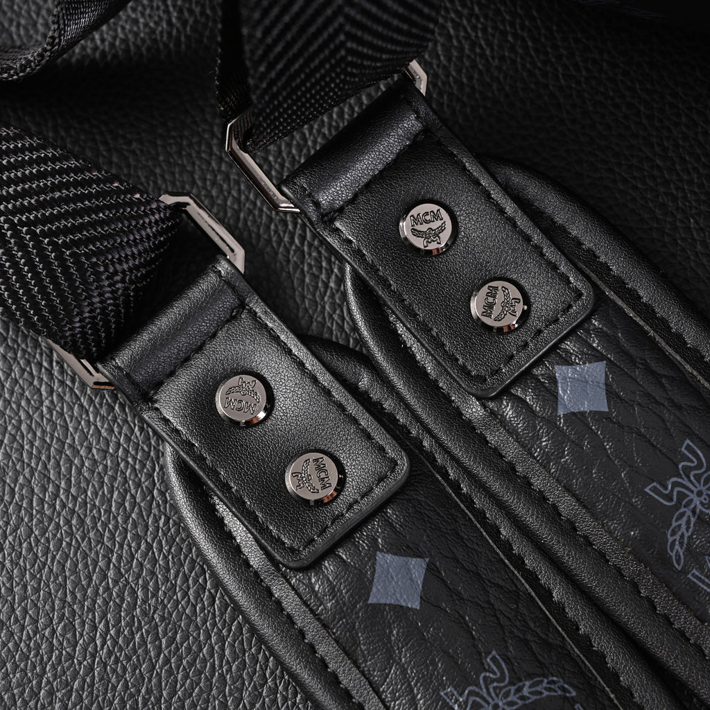 MCM Stark Visetos Medium Backpack ¨C Black Monogram with Studded Detailing