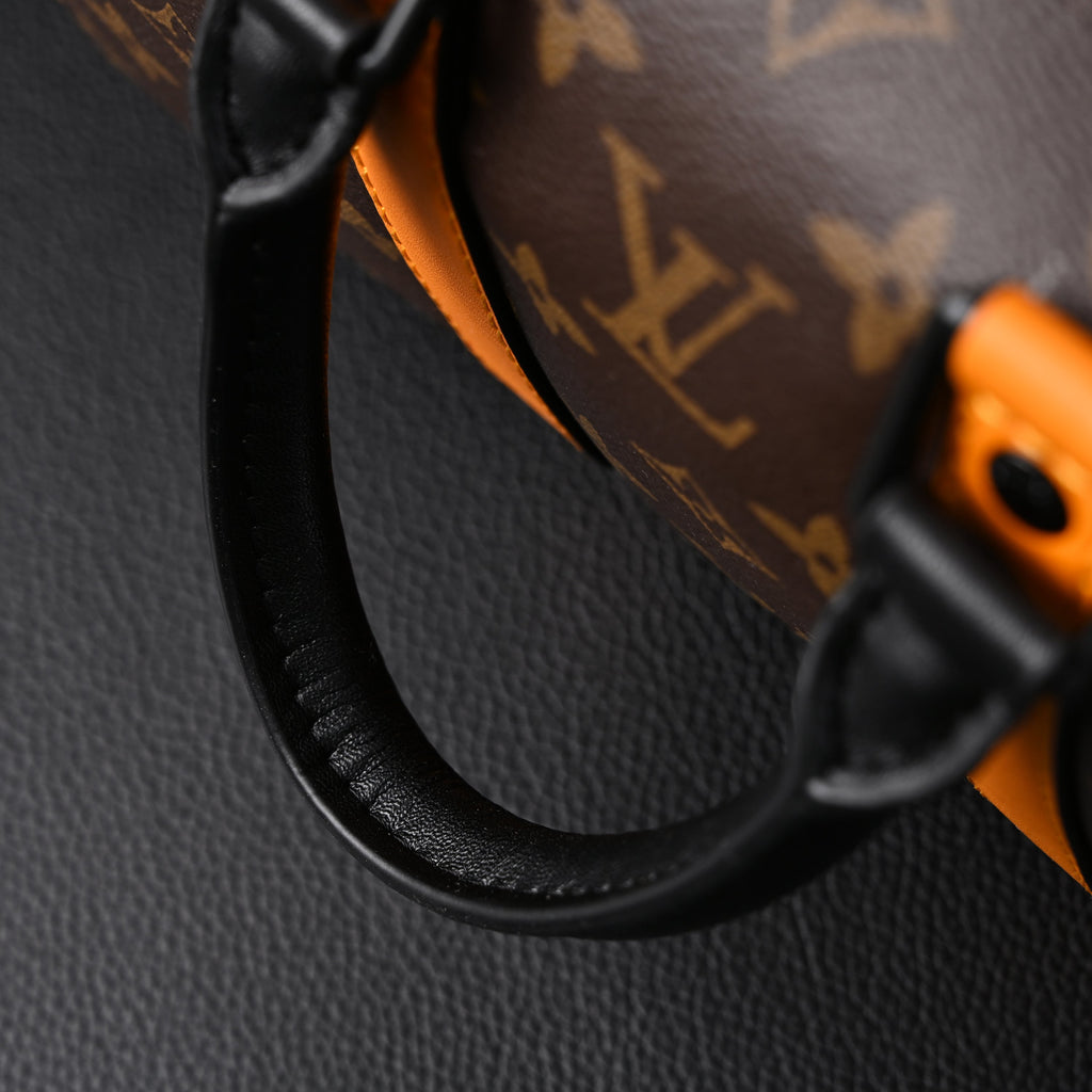 Louis Vuitton Keepall Bandouli¨¨re 50 ¨C Monogram Canvas with Neon Orange Trim