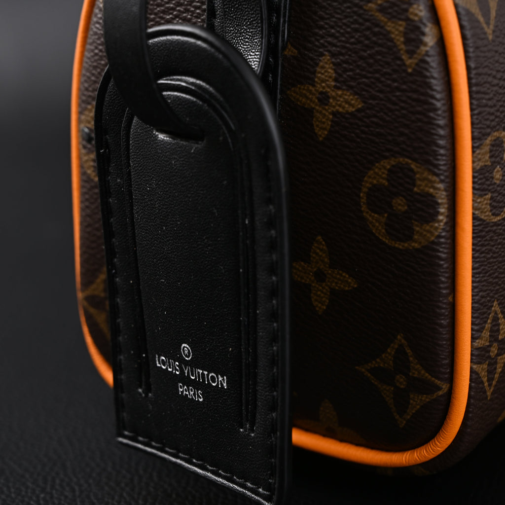 Louis Vuitton Keepall Bandouli¨¨re 50 ¨C Monogram Canvas with Neon Orange Trim
