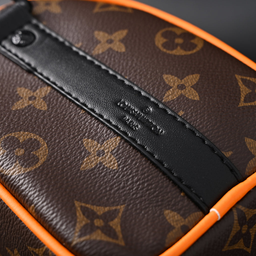 Louis Vuitton Keepall Bandouli¨¨re 50 ¨C Monogram Canvas with Neon Orange Trim
