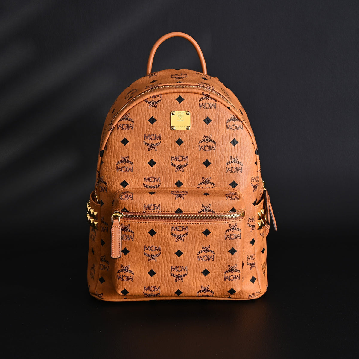 MCM Stark Visetos Medium Backpack ¨C Cognac Monogram with Gold-Tone Studs